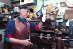 3-2-01 John Lager, owner of Family Shoe Repair talkes to a customer in his shop. Lager  who has been in business for almost 27 years has agreed to sell his shoe repair shop located on Second Street. Photo by: Brian Wallace